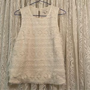 Apricot white sleeveless top with crochet lace fringe overlay.